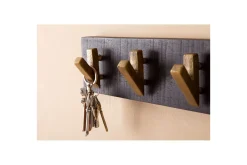 Garderobe Wohnling Vegghengt klesstativ 6 gylne metallkroker elegant i svart gull