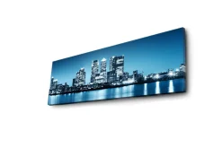 Lerretsbilde med LED-belysning 30x90 cm - Bysilhuett med moderne skyskrapere ved vannkanten